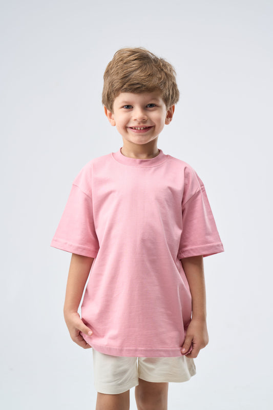 Child wearing a cashmere pink oversized t-shirt