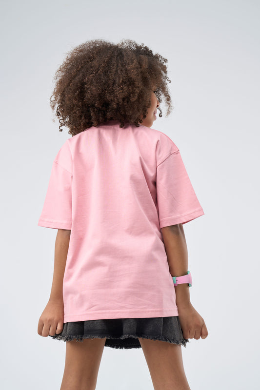 Child wearing a Cashmere Pink printed Oversized T-Shirt