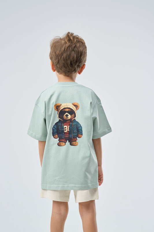 Child wearing a Mint Green Oversized t-shirt with a bear graphic on the back