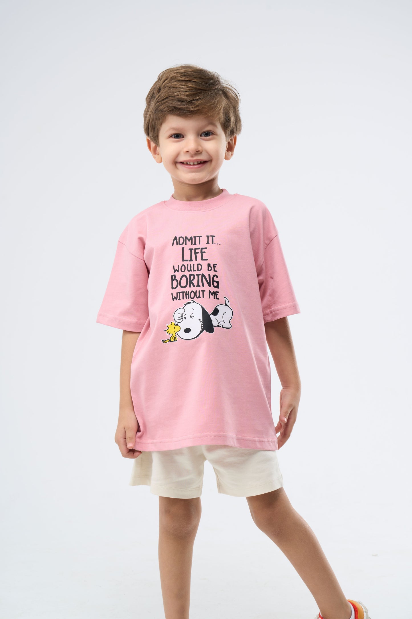 Child wearing a Cashmere Pink printed oversized t-shirt
