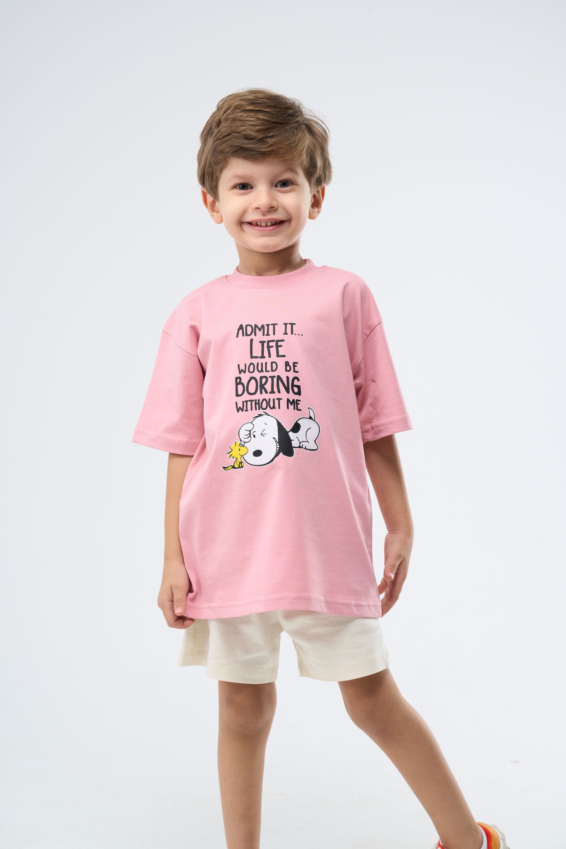 Child wearing a Cashmere Pink printed oversized t-shirt