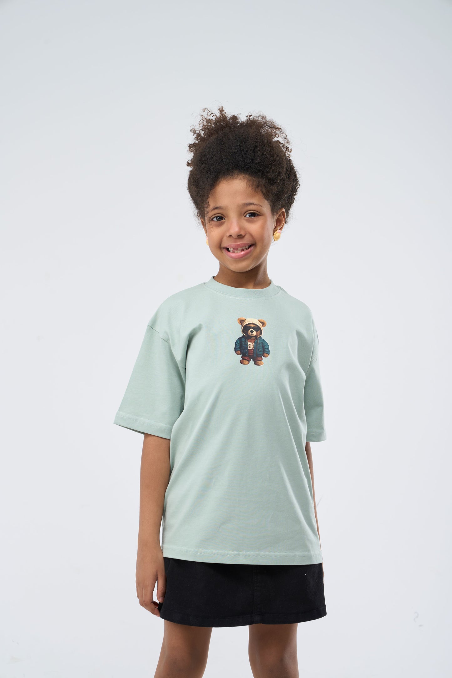Child wearing a Mint Green Oversized T-Shirt with a bear graphic printed