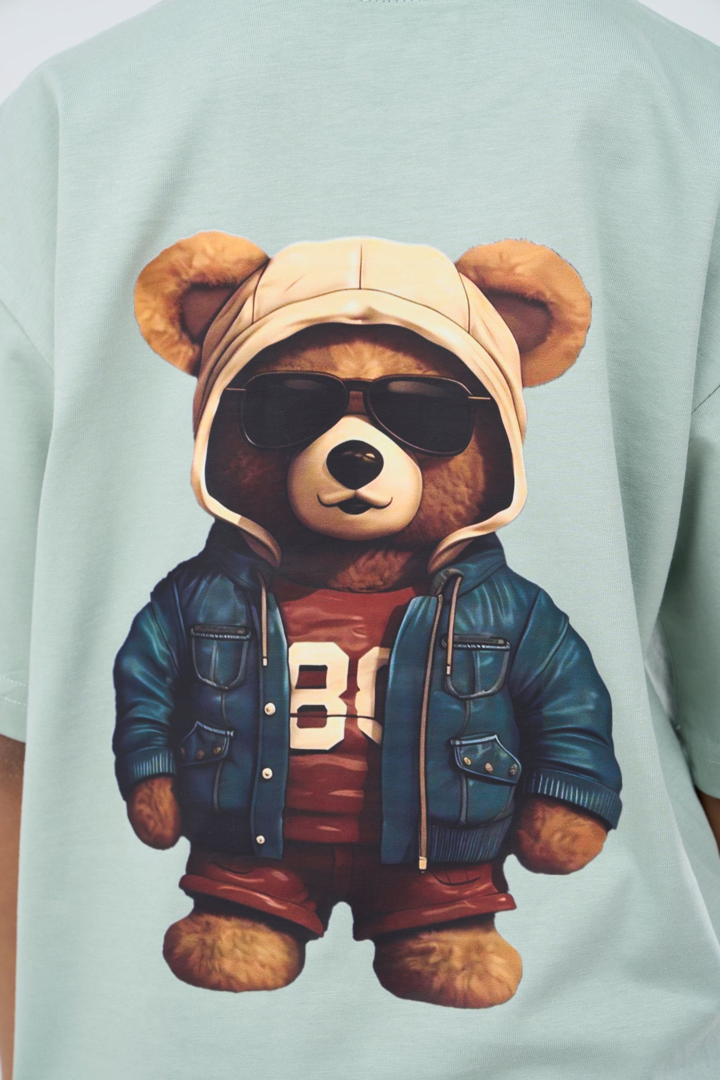 Mint Green Oversized T-Shirt with a teddy bear wearing sunglasses, a cap, and a jacket graphic